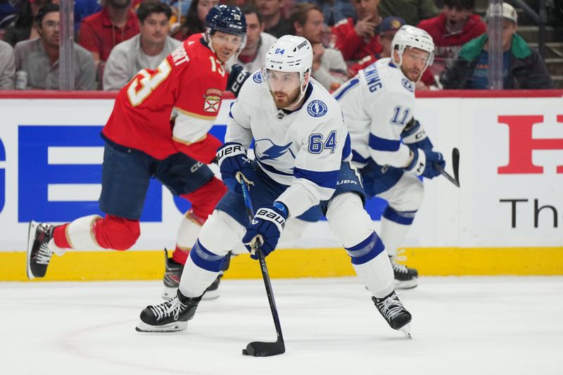 Apr 29, 2024; Sunrise, Florida, USA; Tampa Bay Lightning center Tyler Motte (64) looks to pass the puck against the Florida Panthers during the first period in game five of the first round of the 2024 Stanley Cup Playoffs at Amerant Bank Arena. Mandatory Credit: Jim Rassol-USA TODAY Sports