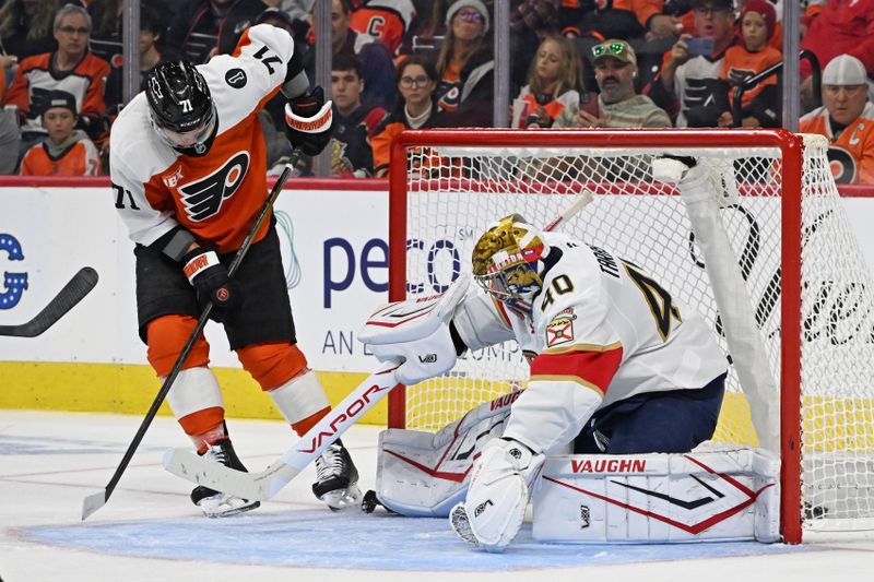 Oct 13, 2025; Philadelphia, Pennsylvania, USA; Florida Panthers goaltender Daniil Tarasov (40) makes a save against Philadelphia Flyers right wing Tyson Foerster (71) during the second period at Wells Fargo Center. Mandatory Credit: Eric Hartline-Imagn Images
