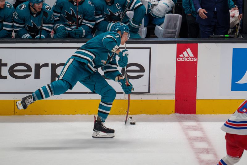 Nov 19, 2022; San Jose, California, USA; San Jose Sharks center Nico Sturm (7) shoots the puck during the third period against the New York Rangers during the third period at SAP Center at San Jose. Mandatory Credit: Neville E. Guard-USA TODAY Sports