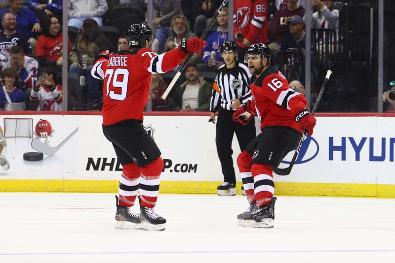 Sep 30, 2024; Newark, New Jersey, USA; New Jersey Devils right wing Nathan Legare (16) celebrates his goal against the New York Rangers during the first period at Prudential Center. Mandatory Credit: Ed Mulholland-Imagn Images