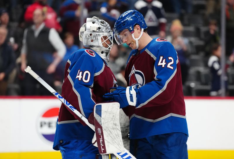 Nov 27, 2023; Denver, Colorado, USA; Colorado Avalanche goaltender Alexandar Georgiev (40) and defenseman Josh Manson (42) celebrate the win over the Tampa Bay Lightning at Ball Arena. Mandatory Credit: Ron Chenoy-USA TODAY Sports