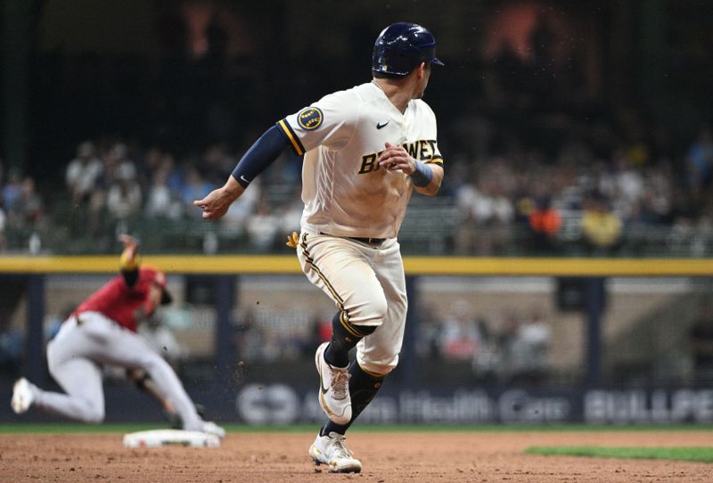 Jun 20, 2023; Milwaukee, Wisconsin, USA; Milwaukee Brewers third baseman Luis Urias (2) runs to third base against the Arizona Diamondbacks in the seventh inning at American Family Field. Mandatory Credit: Michael McLoone-USA TODAY Sports