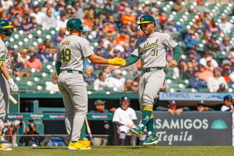 Apr 7, 2024; Detroit, Michigan, USA; Oakland Athletics third baseman Abraham Toro (31) celebrates as he runs home during the second inning of the game against the Detroit Tigers at Comerica Park. Mandatory Credit: Brian Bradshaw Sevald-USA TODAY Sports