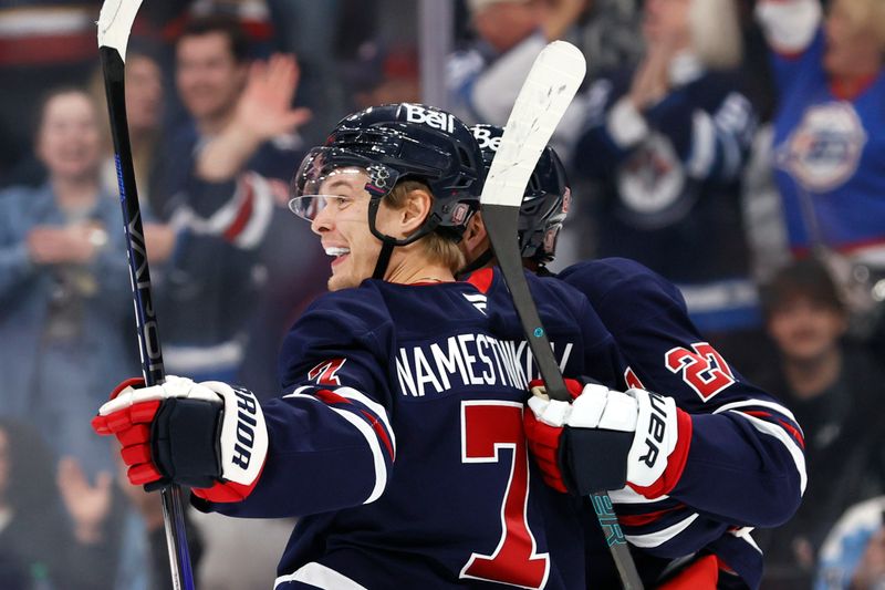 Oct 20, 2024; Winnipeg, Manitoba, CAN; Winnipeg Jets center Vladislav Namestnikov (7) celebrates his second period goal against the Pittsburgh Penguins at Canada Life Centre. Mandatory Credit: James Carey Lauder-Imagn Images