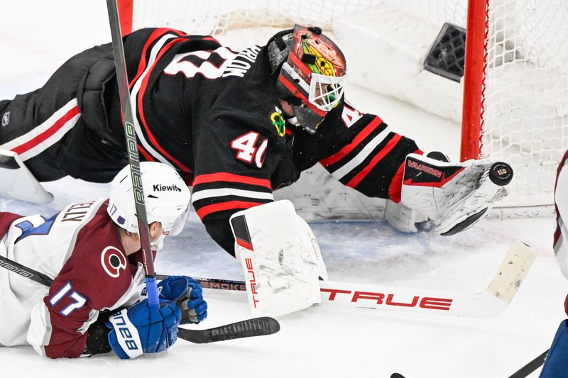Mar 20, 2026; Chicago, Illinois, USA;  Chicago Blackhawks goaltender Arvid Soderblom (40) defends against Colorado Avalanche center Parker Kelly (17) during the third period at United Center. Mandatory Credit: Matt Marton-Imagn Images
