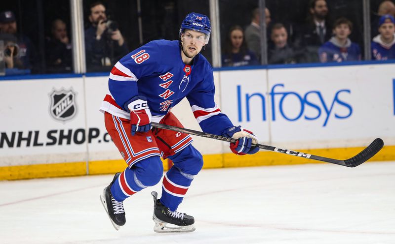 Jan 18, 2025; New York, New York, USA; New York Rangers defenseman Urho Vaakanainen (18) skates against the Columbus Blue Jackets during the second period at Madison Square Garden. Mandatory Credit: Danny Wild-Imagn Images