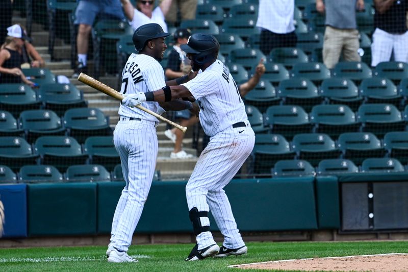 Aug 23, 2023; Chicago, Illinois, USA;  Chicago White Sox shortstop Tim Anderson (7), left, celebrates with Chicago White Sox shortstop Elvis Andrus (1) after scoring during the tenth inning to beat the Seattle Mariners at Guaranteed Rate Field. Mandatory Credit: Matt Marton-USA TODAY Sports