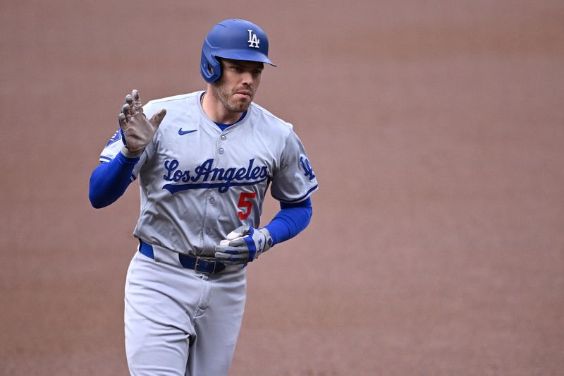 May 11, 2024; San Diego, California, USA; Los Angeles Dodgers first baseman Freddie Freeman (5) rounds the bases after hitting a home run against the San Diego Padres during the first inning at Petco Park. Mandatory Credit: Orlando Ramirez-USA TODAY Sports