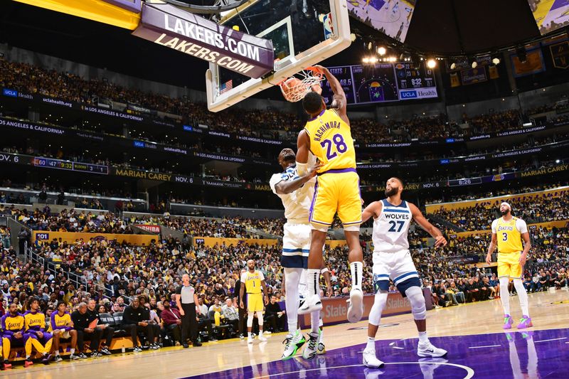 LOS ANGELES, CA - OCTOBER 22: Rui Hachimura #28 of the Los Angeles Lakers dunks the ball during the game against the Minnesota Timberwolves on October 22, 2024 at Crypto.Com Arena in Los Angeles, California. NOTE TO USER: User expressly acknowledges and agrees that, by downloading and/or using this Photograph, user is consenting to the terms and conditions of the Getty Images License Agreement. Mandatory Copyright Notice: Copyright 2024 NBAE (Photo by Adam Pantozzi/NBAE via Getty Images)