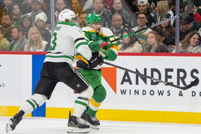 Nov 16, 2024; Saint Paul, Minnesota, USA; Dallas Stars defenseman Mathew Dumba (3) checks Minnesota Wild center Jakub Lauko (94) in the first period at Xcel Energy Center. Mandatory Credit: Matt Blewett-Imagn Images