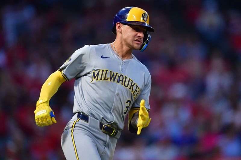 Jun 18, 2024; Anaheim, California, USA; Milwaukee Brewers third base Joey Ortiz (3) reaches first on a single against the Los Angeles Angels during the sixth inning at Angel Stadium. Mandatory Credit: Gary A. Vasquez-USA TODAY Sports