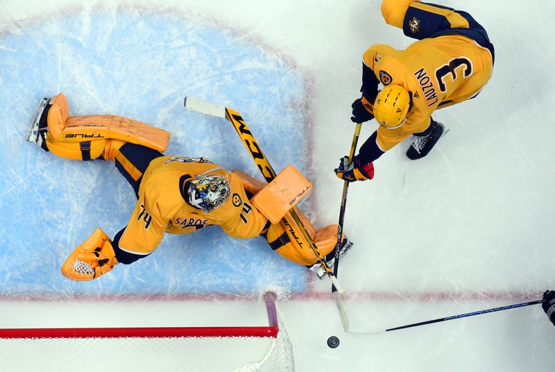 Jan 21, 2023; Nashville, Tennessee, USA; Nashville Predators goaltender Juuse Saros (74) makes a save at the side of the net during the first period against the Los Angeles Kings at Bridgestone Arena. Mandatory Credit: Christopher Hanewinckel-USA TODAY Sports