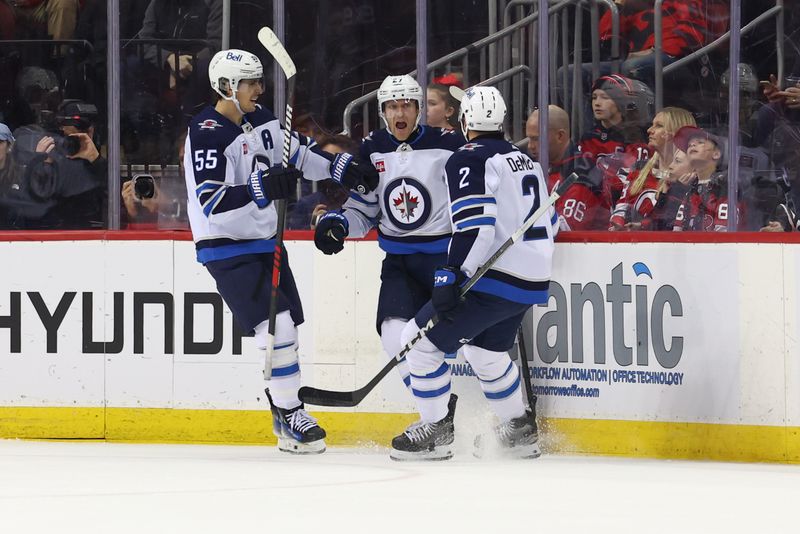 Mar 21, 2024; Newark, New Jersey, USA; Winnipeg Jets left wing Nikolaj Ehlers (27) celebrates his goal against the New Jersey Devils during the second period at Prudential Center. Mandatory Credit: Ed Mulholland-USA TODAY Sports