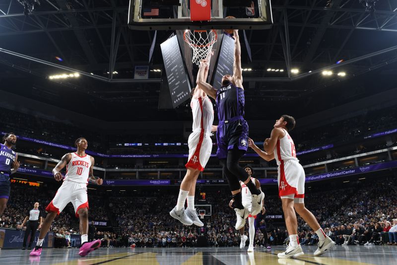 SACRAMENTO, CA - DECEMBER 3: Domantas Sabonis #11 of the Sacramento Kings drives to the basket during the game against the Houston Rockets during the Emirates NBA Cup game on December 3, 2024 at Golden 1 Center in Sacramento, California. NOTE TO USER: User expressly acknowledges and agrees that, by downloading and or using this Photograph, user is consenting to the terms and conditions of the Getty Images License Agreement. Mandatory Copyright Notice: Copyright 2024 NBAE (Photo by Adam Pantozzi/NBAE via Getty Images)