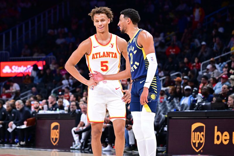 ATLANTA, GA - OCTOBER 8: Dyson Daniels #5 of the Atlanta Hawks and Tyrese Haliburton #0 of the Indiana Pacers talk during the game during a NBA preseason game on October 8, 2024 at State Farm Arena in Atlanta, Georgia.  NOTE TO USER: User expressly acknowledges and agrees that, by downloading and/or using this Photograph, user is consenting to the terms and conditions of the Getty Images License Agreement. Mandatory Copyright Notice: Copyright 2024 NBAE (Photo by Adam Hagy/NBAE via Getty Images)