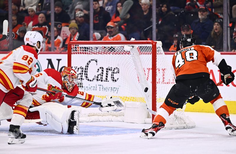 Jan 6, 2024; Philadelphia, Pennsylvania, USA; Philadelphia Flyers center Morgan Frost (48) scores a goal against Calgary Flames goalie Jacob Markstrom (25) in the second period at Wells Fargo Center. Mandatory Credit: Kyle Ross-USA TODAY Sports