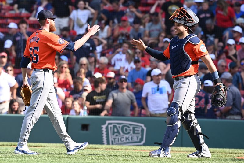 Aug 11, 2024; Boston, Massachusetts, USA; Houston Astros pitcher Shawn Dubin (66)  and catcher Yainer Diaz (21) celebrate beating the Boston Red Sox at Fenway Park. Mandatory Credit: Eric Canha-USA TODAY Sports