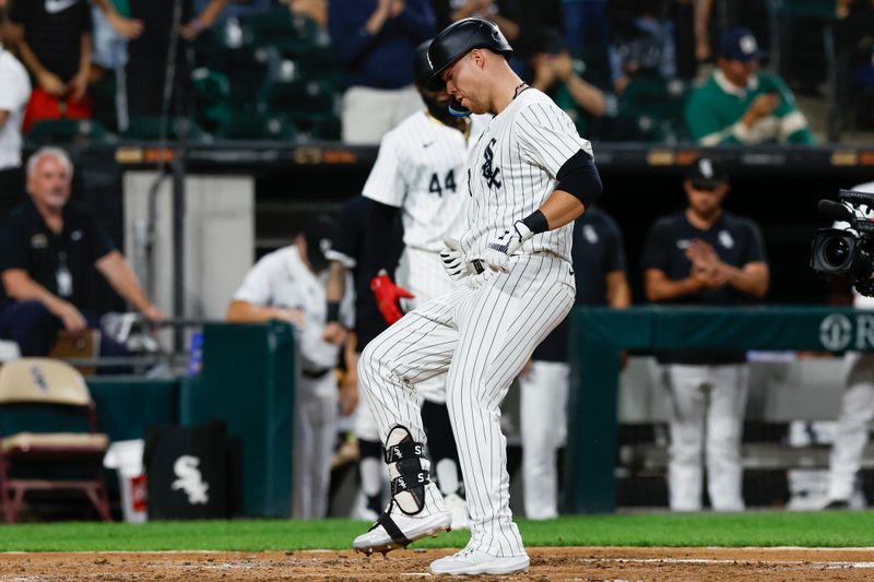 Sep 14, 2024; Chicago, Illinois, USA; Chicago White Sox outfielder Gavin Sheets (32) crosses home plate after hitting a solo home run against the Oakland Athletics during the third inning at Guaranteed Rate Field. Mandatory Credit: Kamil Krzaczynski-Imagn Images