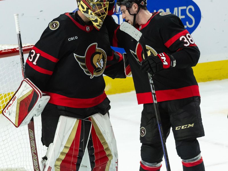 Jan 25, 2025; Ottawa, Ontario, CAN; Ottawa Senators goalie Anton Forsberg (31) and center Zack Ostapchuk (38) celebrate after defeating the Toronto Maple Leafs at the Canadian Tire Centre. Mandatory Credit: Marc DesRosiers-Imagn Images