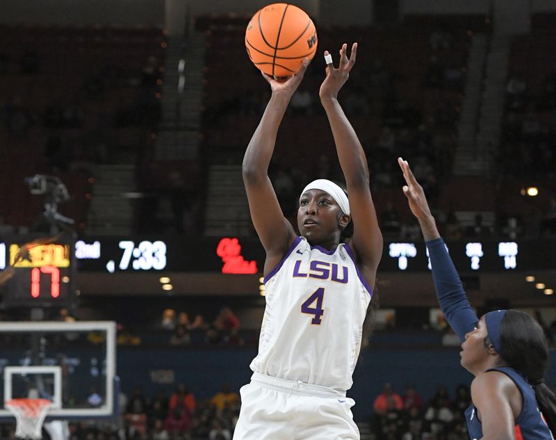 Mar 9, 2024; Greenville, SC, USA; LSU Tigers guard Flau'jae Johnson (4) shoots the ball against Ole Miss Rebels during the second quarter at the Bon Secours Wellness Arena. Mandatory Credit: Ken Ruinard/The Greenville News via USA TODAY NETWORK