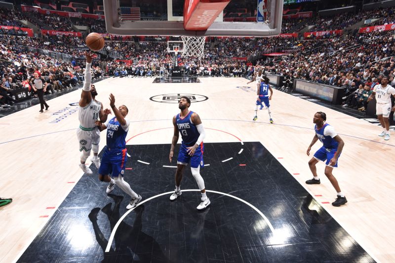 LOS ANGELES, CA - MARCH 12: Mike Conley #10 of the Minnesota Timberwolves drives to the basket during the game LA Clippers on March 12, 2024 at Crypto.Com Arena in Los Angeles, California. NOTE TO USER: User expressly acknowledges and agrees that, by downloading and/or using this Photograph, user is consenting to the terms and conditions of the Getty Images License Agreement. Mandatory Copyright Notice: Copyright 2024 NBAE (Photo by Tyler Ross/NBAE via Getty Images)