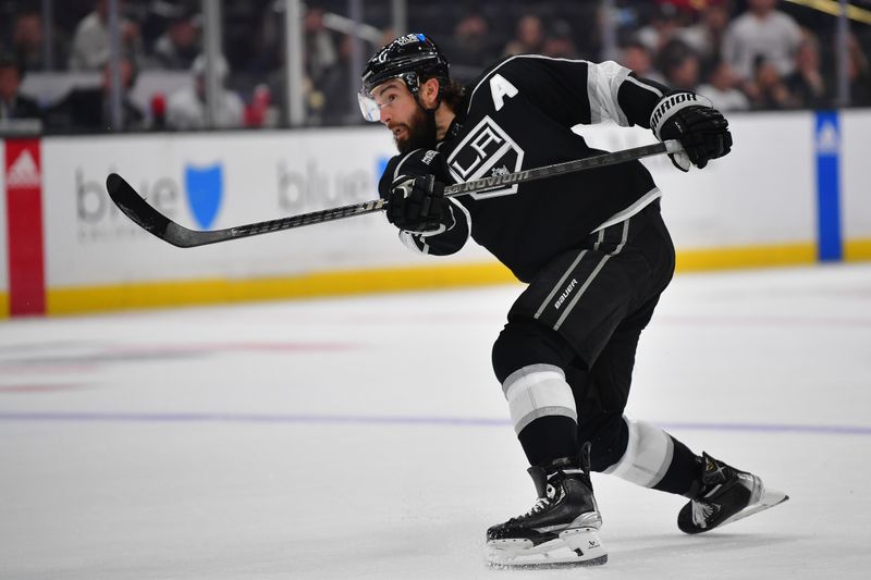 Mar 11, 2024; Los Angeles, California, USA; Los Angeles Kings defenseman Drew Doughty (8) shoots on goal against the New York Islanders during the second period at Crypto.com Arena. Mandatory Credit: Gary A. Vasquez-USA TODAY Sports