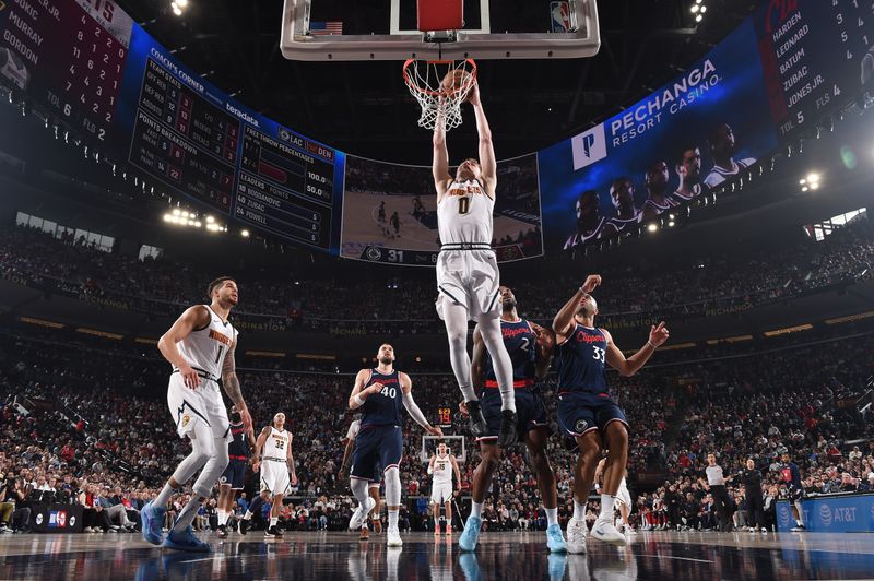 INGLEWOOD, CA - APRIL 26:  Christian Braun #0 of the Denver Nuggets drives to the basket during Round One, Game Four of the 2025 NBA Playoffs against the LA Clippers on April 26, 2025 at Intuit Dome in Los Angeles, California. NOTE TO USER: User expressly acknowledges and agrees that, by downloading and/or using this Photograph, user is consenting to the terms and conditions of the Getty Images License Agreement. Mandatory Copyright Notice: Copyright 2025 NBAE (Photo by Juan Ocampo/NBAE via Getty Images)