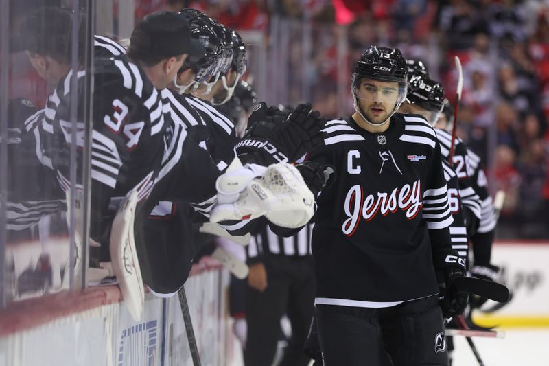 Mar 11, 2025; Newark, New Jersey, USA; New Jersey Devils center Nico Hischier (13) celebrates a goal against the Columbus Blue Jackets during the first period at Prudential Center. Mandatory Credit: Ed Mulholland-Imagn Images