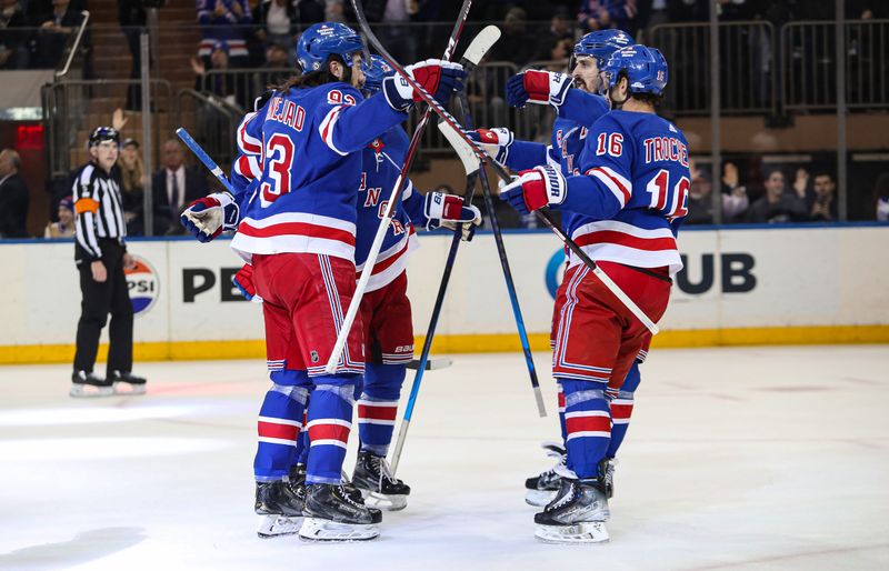 Apr 11, 2024; New York, New York, USA; New York Rangers left wing Artemi Panarin (10) celebrates his goal with center Mika Zibanejad (93), left wing Chris Kreider (20) and center Vincent Trocheck (16) during the first period against the Philadelphia Flyers at Madison Square Garden. Mandatory Credit: Danny Wild-USA TODAY Sports