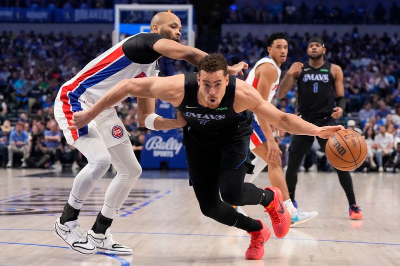 DALLAS, TEXAS - APRIL 12: Dwight Powell #7 of the Dallas Mavericks reaches for a loose ball as Taj Gibson #67 of the Detroit Pistons defends during the first half at American Airlines Center on April 12, 2024 in Dallas, Texas. NOTE TO USER: User expressly acknowledges and agrees that, by downloading and or using this photograph, User is consenting to the terms and conditions of the Getty Images License Agreement. (Photo by Sam Hodde/Getty Images)