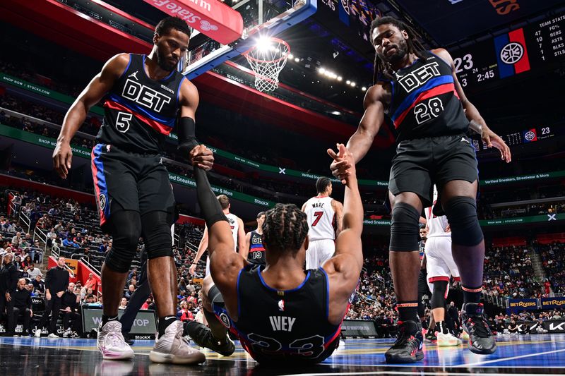 DETROIT, MI - NOVEMBER 12: Malik Beasley #5 and Isaiah Stewart #28 help teammate Jaden Ivey #23 of the Detroit Pistons off the floor during the game against the Miami Heat during the Emirates NBA Cup game on November 12, 2024 at Little Caesars Arena in Detroit, Michigan. NOTE TO USER: User expressly acknowledges and agrees that, by downloading and/or using this photograph, User is consenting to the terms and conditions of the Getty Images License Agreement. Mandatory Copyright Notice: Copyright 2024 NBAE (Photo by Chris Schwegler/NBAE via Getty Images)