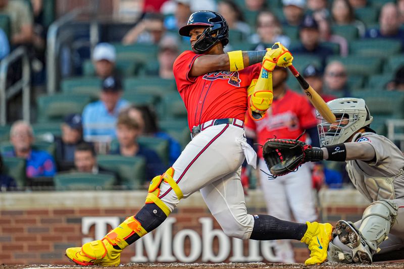 May 30, 2025; Cumberland, Georgia, USA; Atlanta Braves right fielder Ronald Acuna Jr (13) gets an infield single against the Boston Red Sox during the second inning at Truist Park. Mandatory Credit: Dale Zanine-Imagn Images