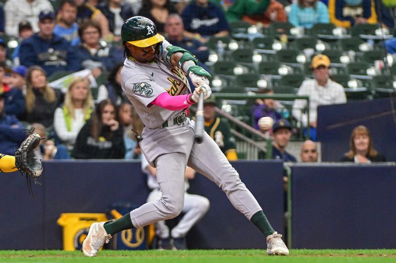 Jun 11, 2023; Milwaukee, Wisconsin, USA; Oakland Athletes center fielder Esteury Ruiz (1) hits a double to drive in two runs against the Milwaukee Brewers in the ninth inning at American Family Field. Mandatory Credit: Benny Sieu-USA TODAY Sports