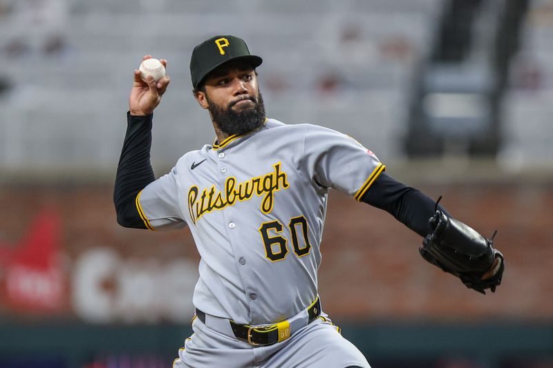 Sep 27, 2025; Cumberland, Georgia, USA; Pittsburgh Pirates pitcher Dennis Santana (60) pitches the ball against the Atlanta Braves during the ninth inning at Truist Park. Mandatory Credit: Jordan Godfree-Imagn Images