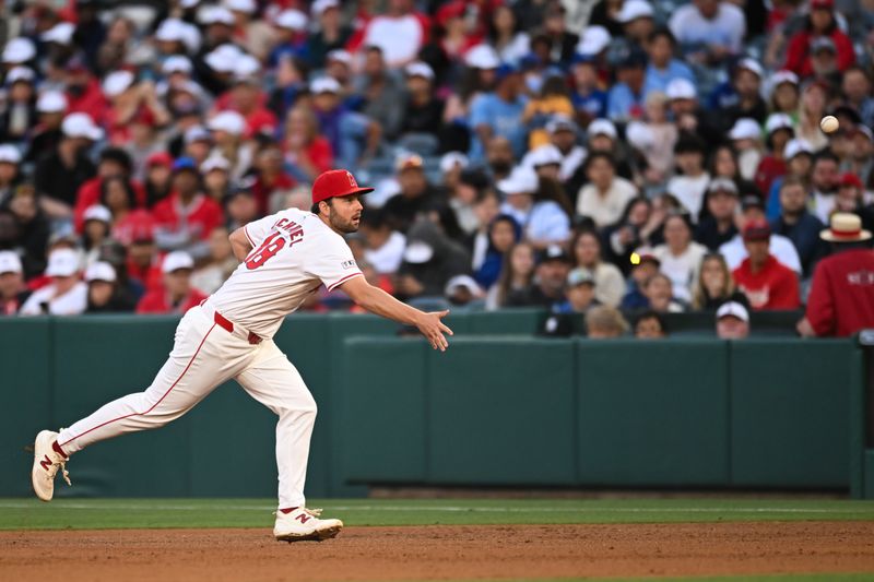 May 11, 2024; Anaheim, California, USA; Los Angeles Angels first baseman Nolan Schanuel (18) fields the ball against the Kansas City Royals during the fourth inning at Angel Stadium. Mandatory Credit: Jonathan Hui-USA TODAY Sports