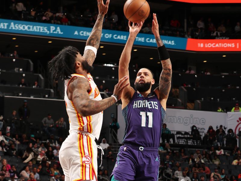 CHARLOTTE, NC - FEBRUARY 14:  Cody Martin #11 of the Charlotte Hornets shoots the ball during the game against the Atlanta Hawks on February 14, 2024 at Spectrum Center in Charlotte, North Carolina. NOTE TO USER: User expressly acknowledges and agrees that, by downloading and or using this photograph, User is consenting to the terms and conditions of the Getty Images License Agreement. Mandatory Copyright Notice: Copyright 2024 NBAE (Photo by Kent Smith/NBAE via Getty Images)