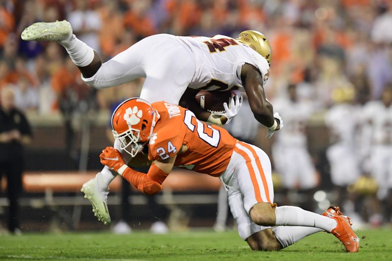 Oct 2, 2021; Clemson, South Carolina, USA; Clemson Tigers safety Nolan Turner (24) tackles Boston College Eagles running back Pat Garwo III (24) during the first quarter at Memorial Stadium. Mandatory Credit: Adam Hagy-USA TODAY Sports