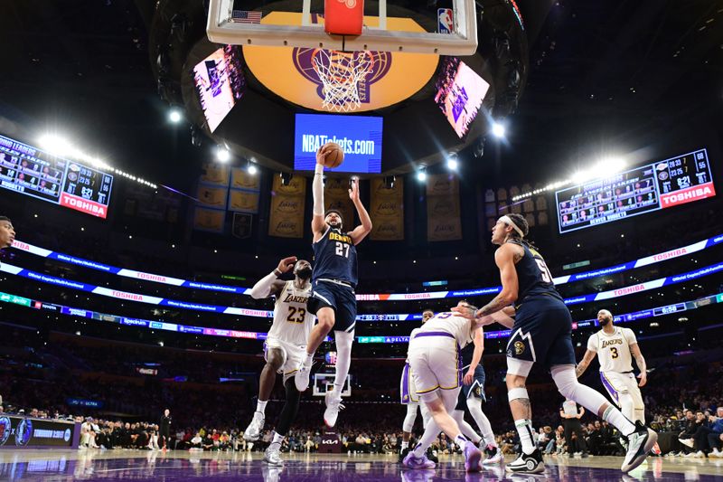 LOS ANGELES, CA - APRIL 27: Jamal Murray #27 of the Denver Nuggets drives to the basket during the game against the Los Angeles Lakers during Round 1 Game 4 of the 2024 NBA Playoffs on April 27, 2024 at Crypto.Com Arena in Los Angeles, California. NOTE TO USER: User expressly acknowledges and agrees that, by downloading and/or using this Photograph, user is consenting to the terms and conditions of the Getty Images License Agreement. Mandatory Copyright Notice: Copyright 2024 NBAE (Photo by Adam Pantozzi/NBAE via Getty Images)