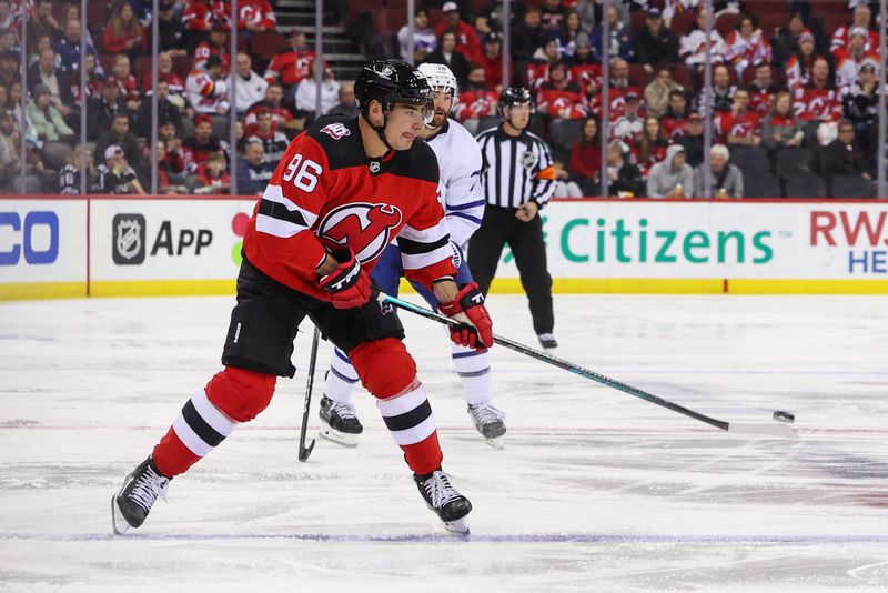 Mar 7, 2023; Newark, New Jersey, USA; New Jersey Devils right wing Timo Meier (96) plays the puck against the Toronto Maple Leafs during the first period at Prudential Center. Mandatory Credit: Ed Mulholland-USA TODAY Sports