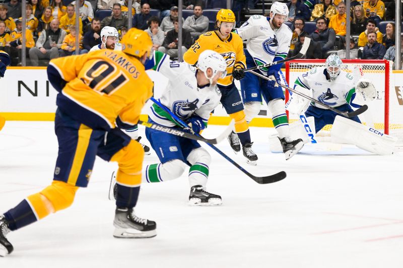Jan 29, 2025; Nashville, Tennessee, USA;  Vancouver Canucks goaltender Thatcher Demko (35) blocks the shot of Nashville Predators center Steven Stamkos (91) during the third period at Bridgestone Arena. Mandatory Credit: Steve Roberts-Imagn Images