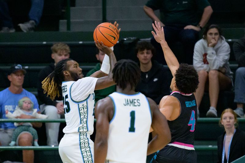 Jan 11, 2024; New Orleans, Louisiana, USA; Tulane Green Wave guard Jaylen Forbes (25) shoots over Florida Atlantic Owls guard Bryan Greenlee (4) during the first half at Avron B. Fogelman Arena in Devlin Fieldhouse. Mandatory Credit: Matthew Hinton-USA TODAY Sports