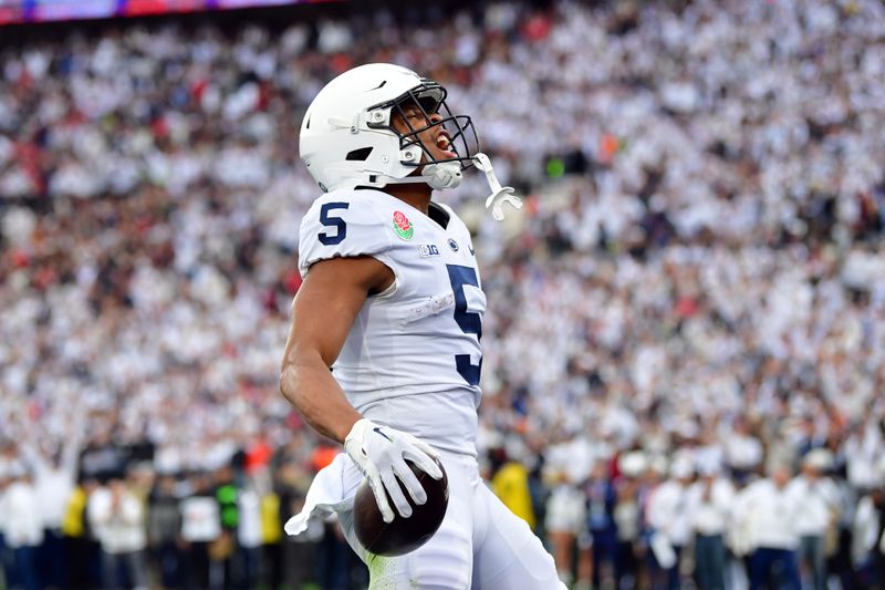 Jan 2, 2023; Pasadena, California, USA; Penn State Nittany Lions wide receiver Mitchell Tinsley (5) celebrates after making a catch for a touchdown in the second quarter against the Utah Utes in the 109th Rose Bowl game at the Rose Bowl. Mandatory Credit: Gary A. Vasquez-USA TODAY Sports