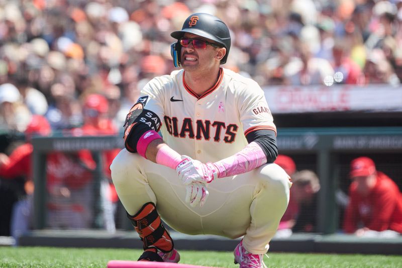 May 12, 2024; San Francisco, California, USA; San Francisco Giants catcher Blake Sabol (21) reacts after being hit by a pitch against the Cincinnati Reds during the fourth inning at Oracle Park. Mandatory Credit: Robert Edwards-USA TODAY Sports