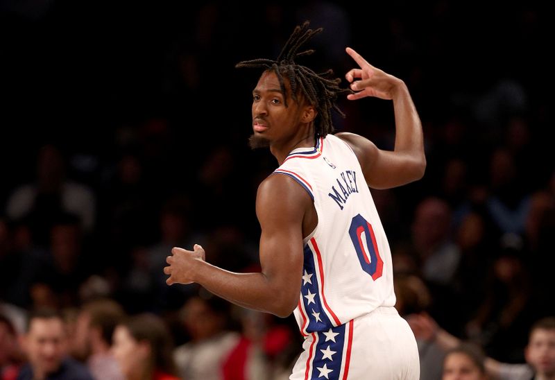 NEW YORK, NEW YORK - NOVEMBER 19:  Tyrese Maxey #0 of the Philadelphia 76ers celebrates his three point shot in the second half against the Brooklyn Nets at Barclays Center on November 19, 2023 in the Brooklyn borough of New York City. The Philadelphia 76ers defeated the Brooklyn Nets 121-99. NOTE TO USER: User expressly acknowledges and agrees that, by downloading and or using this photograph, User is consenting to the terms and conditions of the Getty Images License Agreement. (Photo by Elsa/Getty Images)