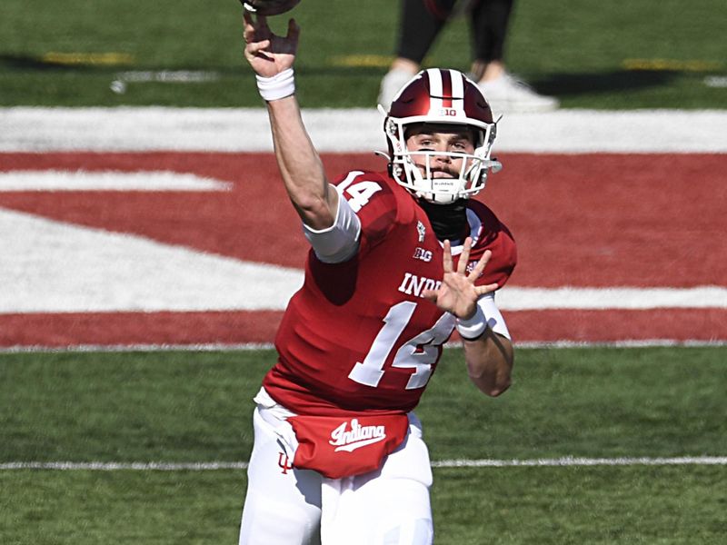 Oct 24, 2020; Bloomington, Indiana, USA; Indiana Hoosiers quarterback Jack Tuttle (14) warms up before the game against the Penn State Nittany Lions. Mandatory Credit: Marc Lebryk-USA TODAY Sports