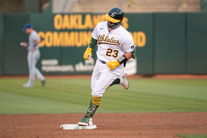 Aug 22, 2023; Oakland, California, USA; Oakland Athletics catcher Shea Langeliers (23) rounds second base after hitting a home run during the second inning against the Kansas City Royals at Oakland-Alameda County Coliseum. Mandatory Credit: Ed Szczepanski-USA TODAY Sports