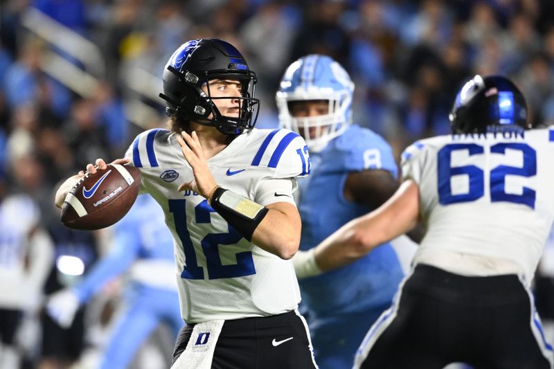 Nov 11, 2023; Chapel Hill, North Carolina, USA; Duke Blue Devils quarterback Grayson Loftis (12) looks to pass in the second quarter at Kenan Memorial Stadium. Mandatory Credit: Bob Donnan-USA TODAY Sports