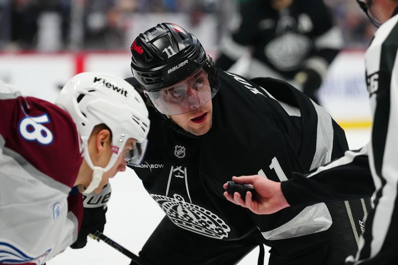 Dec 29, 2025; Denver, Colorado, USA; Los Angeles Kings center Anze Kopitar (11) prepares to take a face off in the first period against the Colorado Avalanche at Ball Arena. Mandatory Credit: Ron Chenoy-Imagn Images