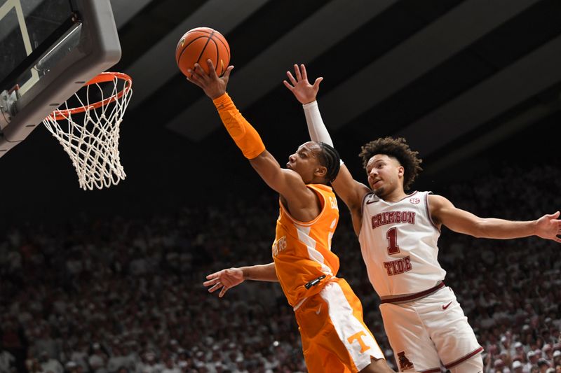 Mar 2, 2024; Tuscaloosa, Alabama, USA;  Tennessee guard Jordan Gainey (2) goes to the rim and is defended by Alabama guard Mark Sears (1) at Coleman Coliseum. Mandatory Credit: Gary Cosby Jr.-USA TODAY Sports