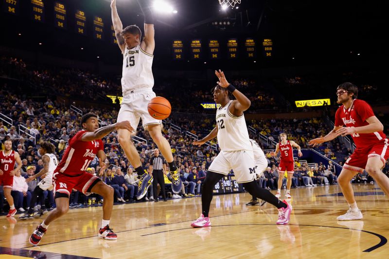 Feb 8, 2023; Ann Arbor, Michigan, USA;  Nebraska Cornhuskers guard Jamarques Lawrence (10) passes defended by Michigan Wolverines guard Joey Baker (15) in the second half at Crisler Center. Mandatory Credit: Rick Osentoski-USA TODAY Sports